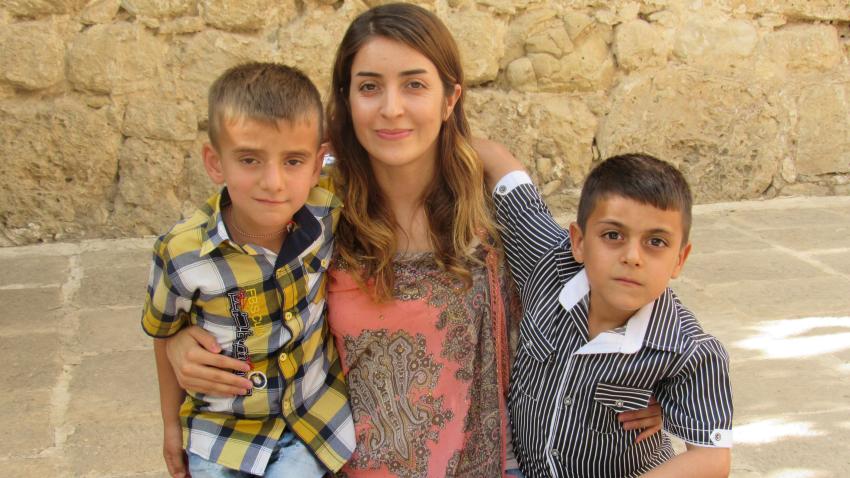 Adiba Qasim pictured with two children