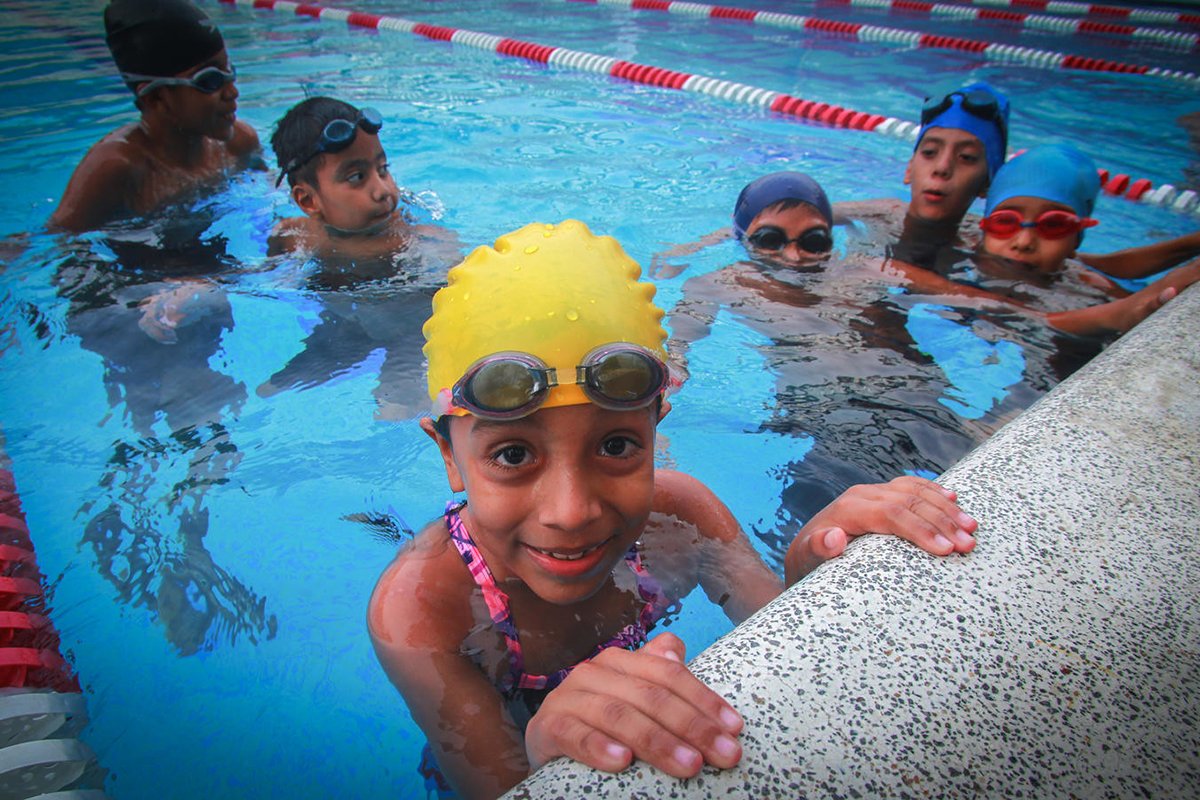 Children swim in a local recreation centre, El Salvador.
