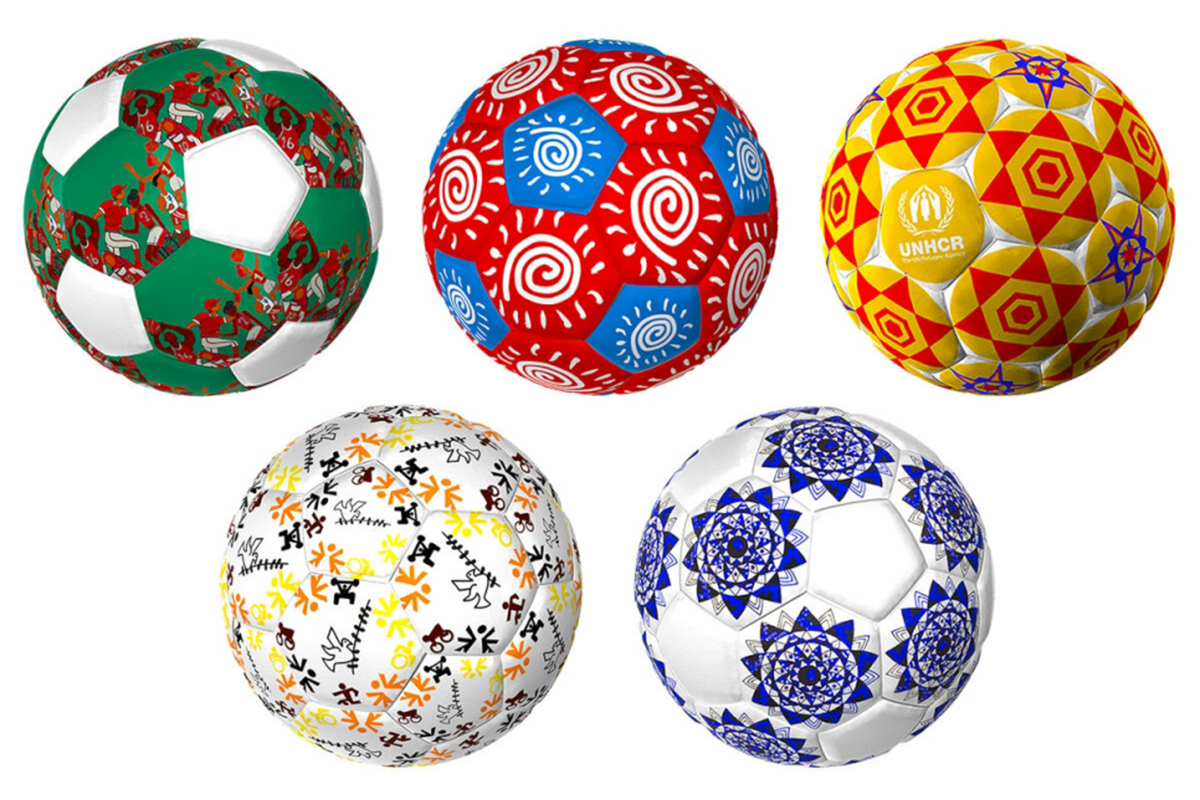 Five footballs with designs