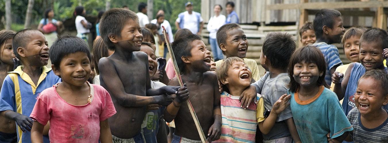A group of children from the indigenous Emberá people smiling.