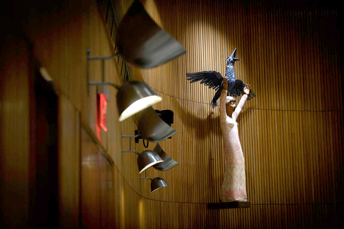 sculpture of a woman releasing a bird