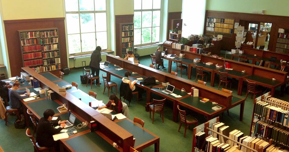 Bird's Eye view of the library with study desks and book shelves.