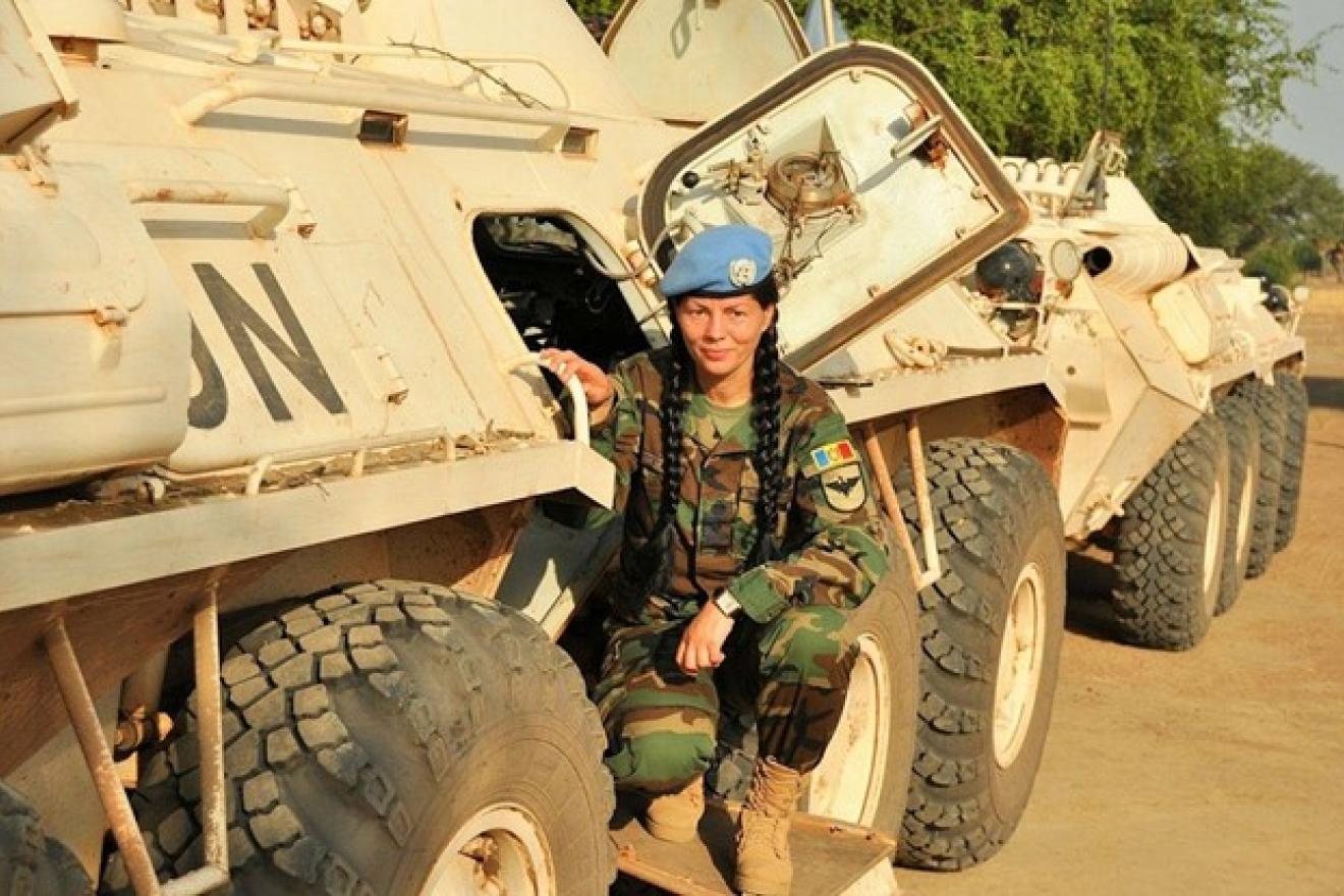 A woman on a UN army vehicle